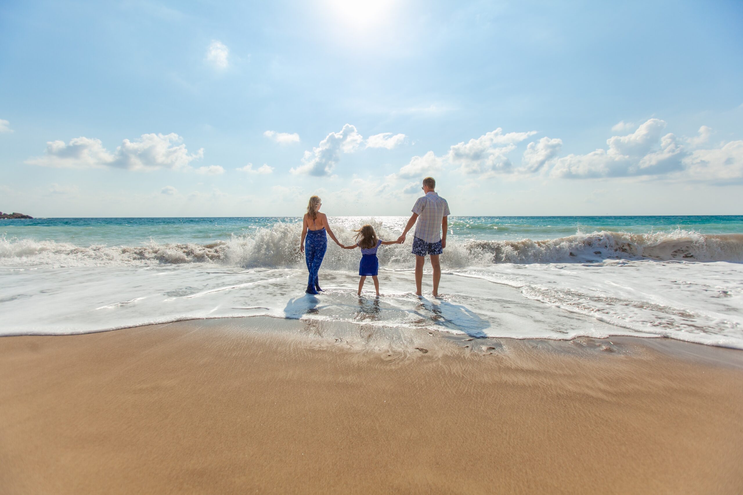 Small family on beach banner