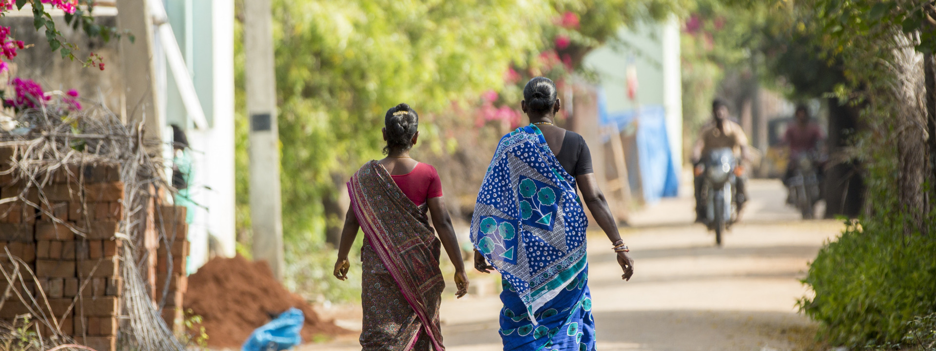 Two women walking banner