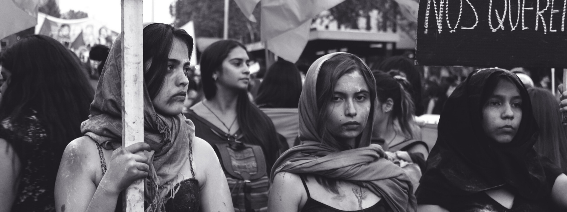 Women at demo banner